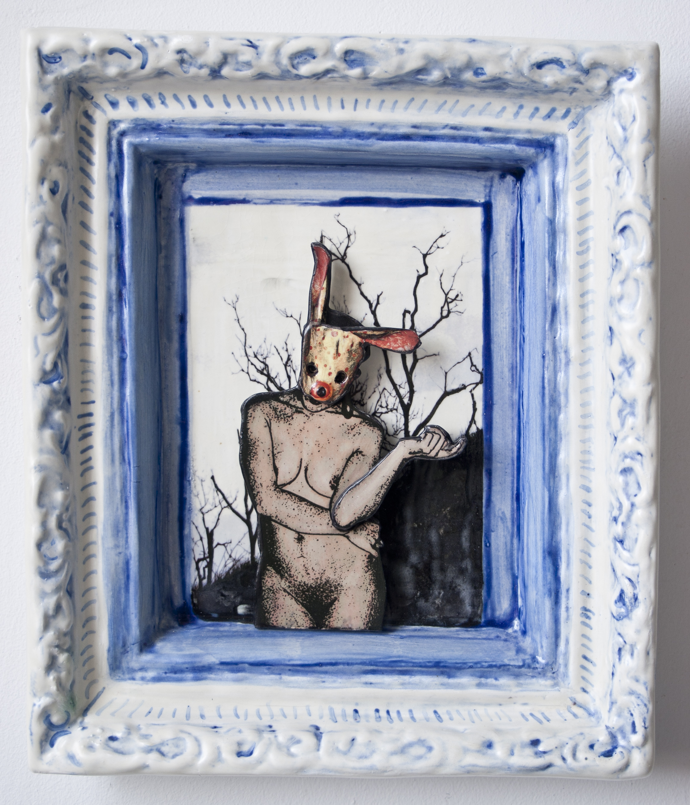 rabbit masked nude with dark trees behind