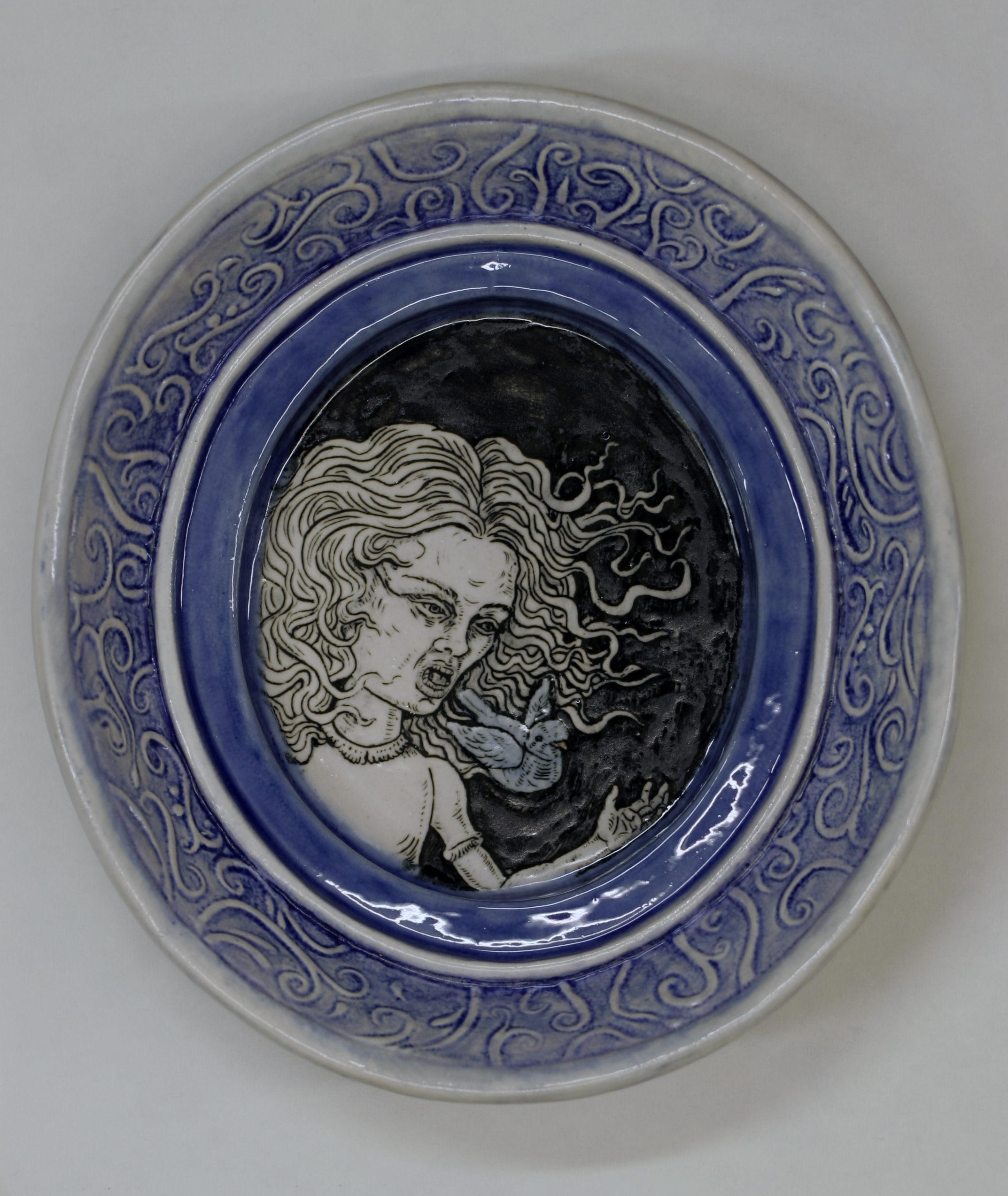Ceramics, decal of girl with flowing hari and blue bird coming out of her mouth, oval frame