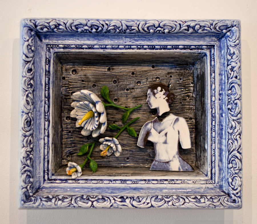 ceramic relief of women in foundation garment, no lower arms, head separate, decals from 1950 bra advertisment, large 3D flowers coming from mouth